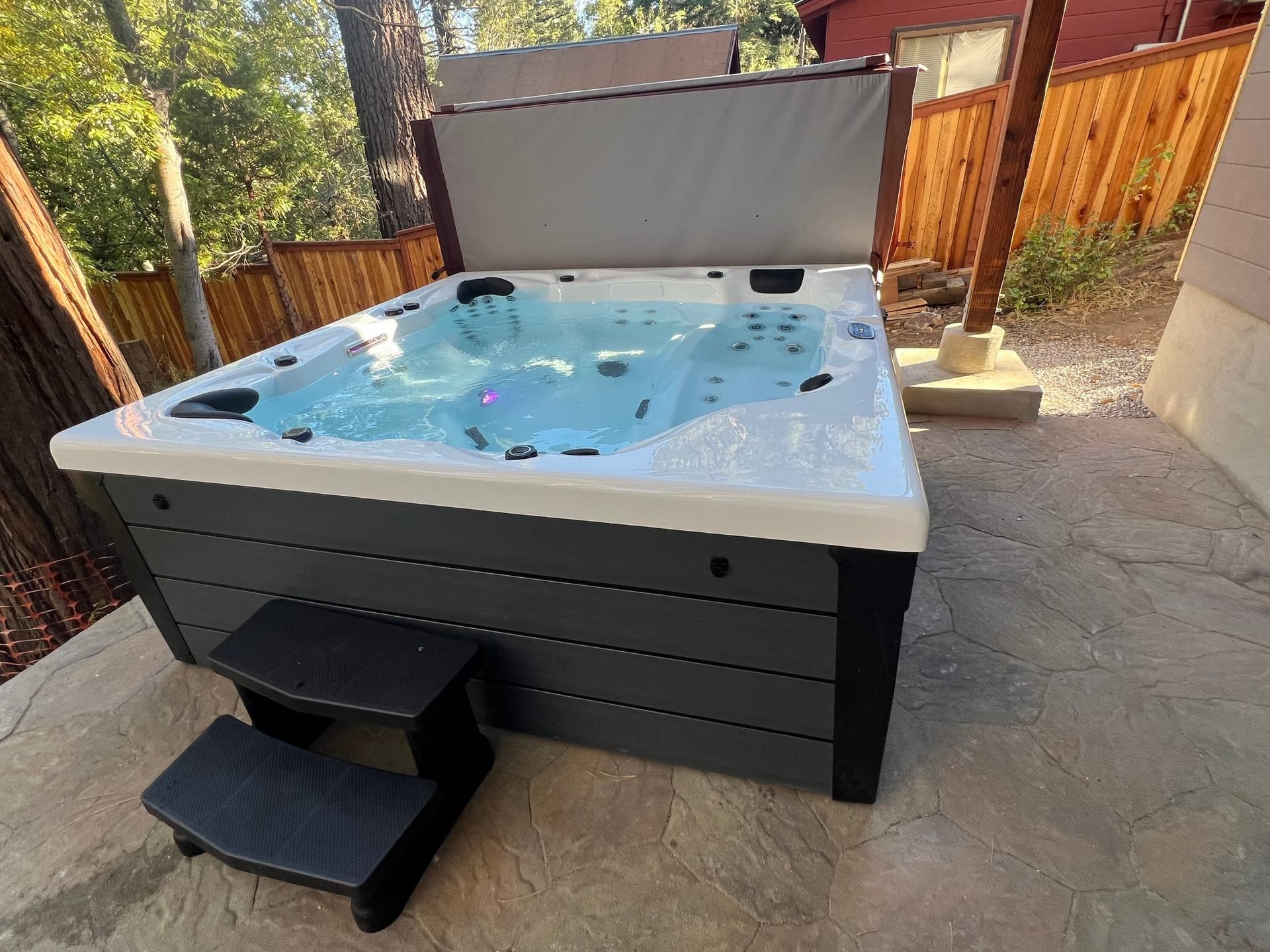Private outdoor hot tub on the stone patio